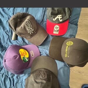 New Era Black Baseball Cap with Red Brim (Pack of Multiple Caps Visible)